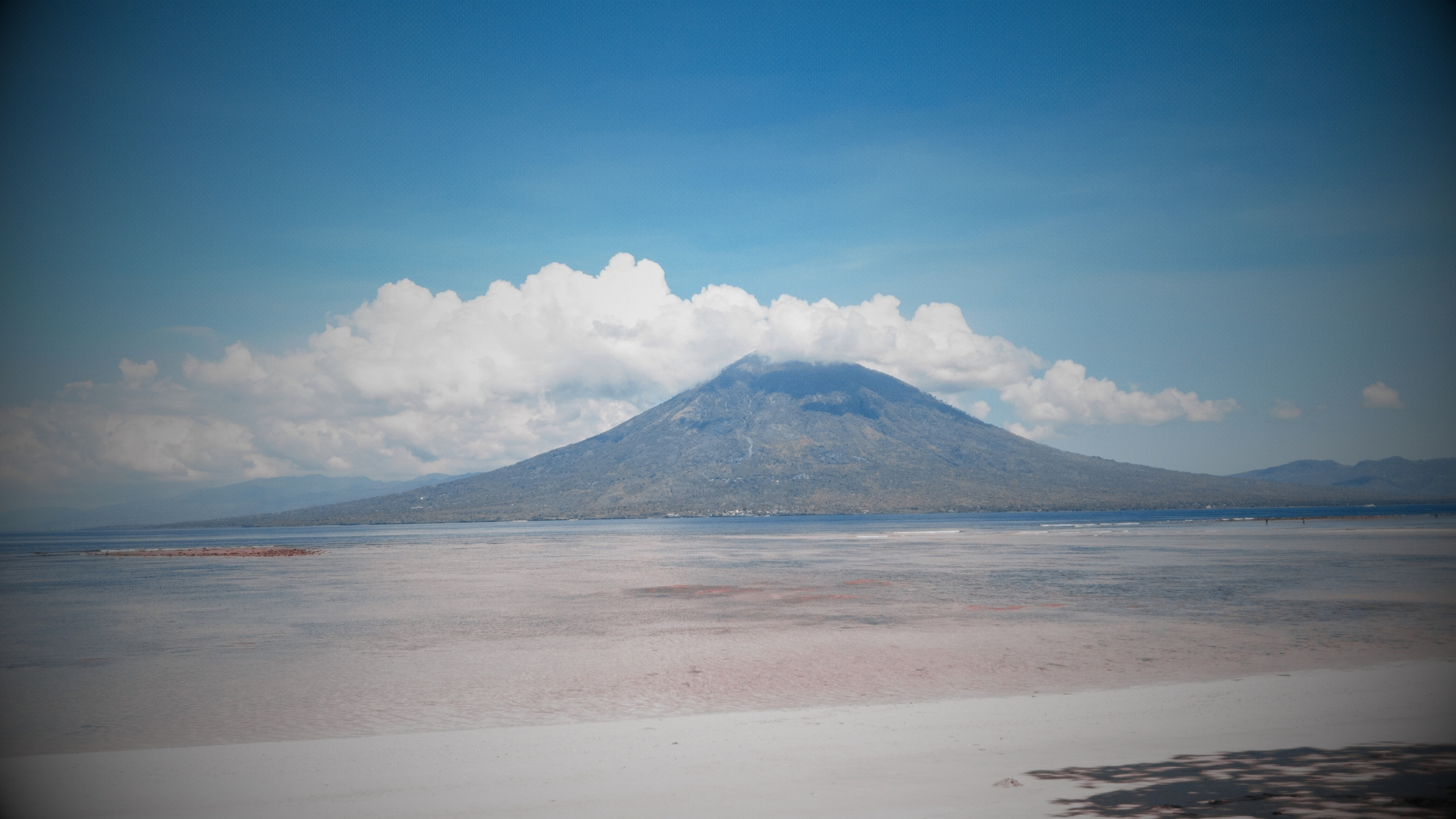 Lewotolok volcano with an ash plume above its summit