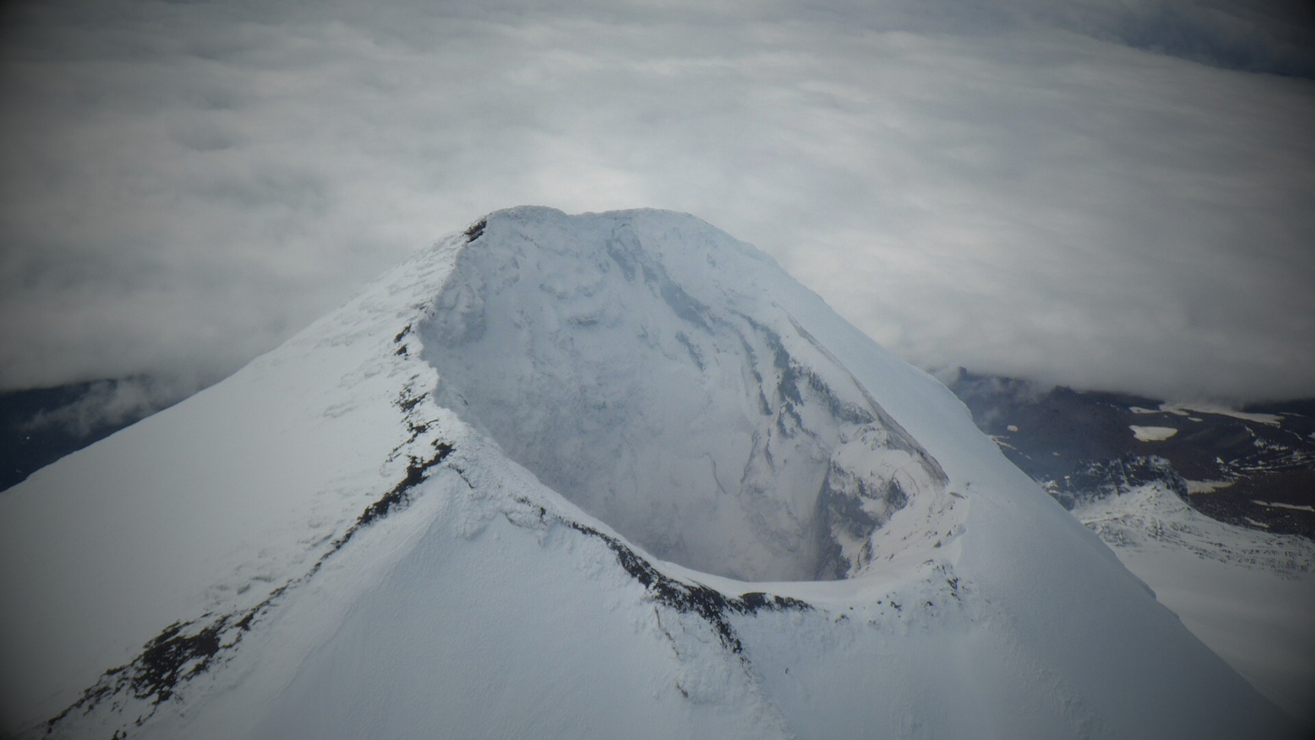 Shishaldin's steep symmetrical cone rising above Unimak Island